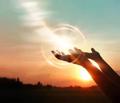 woman hands praying for blessing from god on sunset background