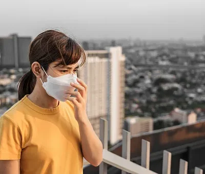 young asian woman wearing n95 respiratory mask protect and filter pm2 5 or particulate matter